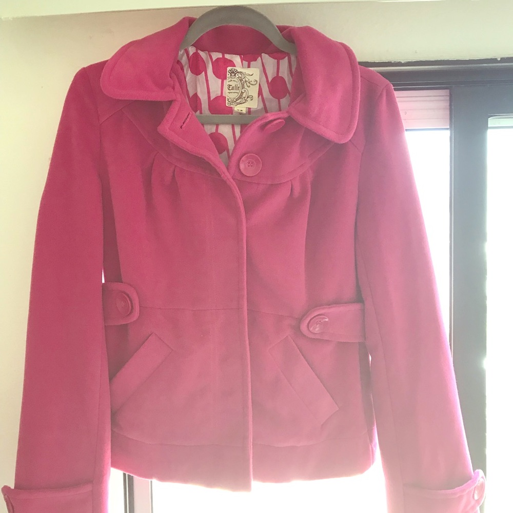 Bright pink coat.